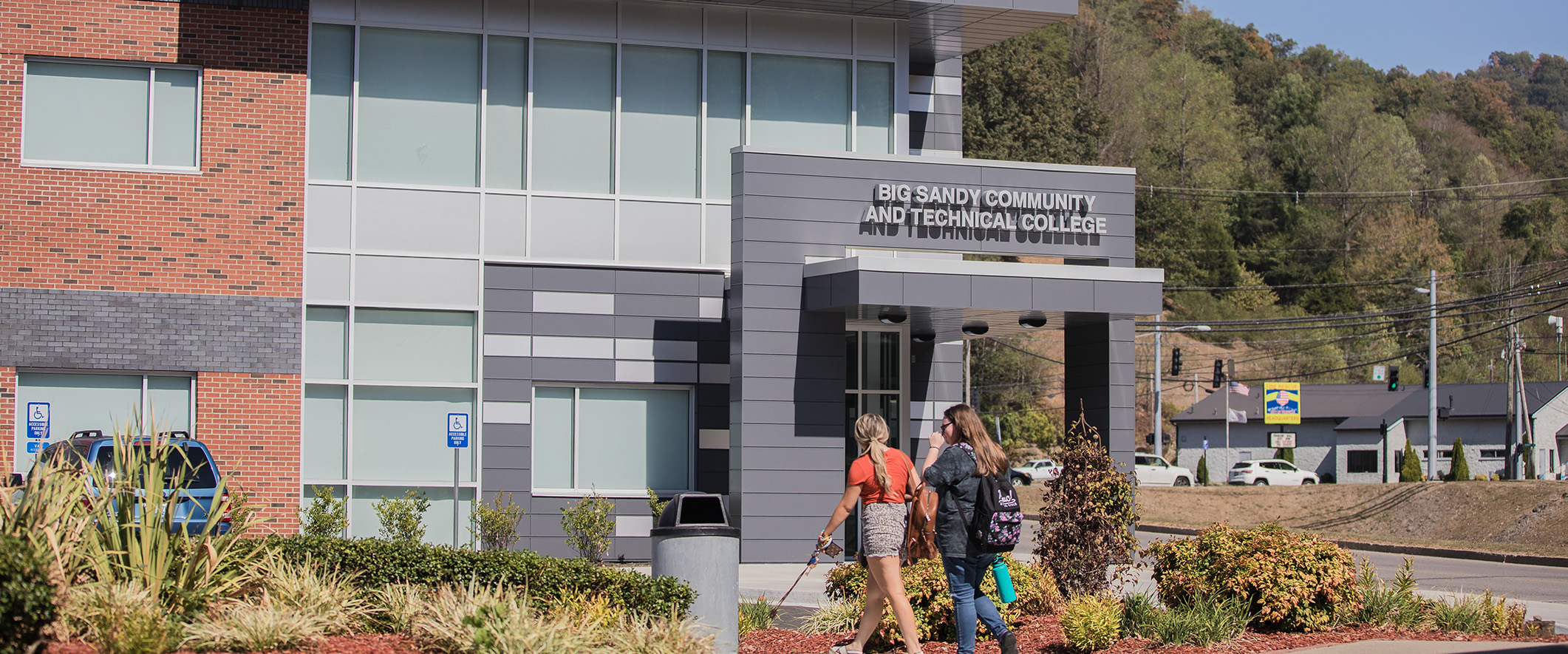 Two girls walking in front of the technology center building at Pikeville