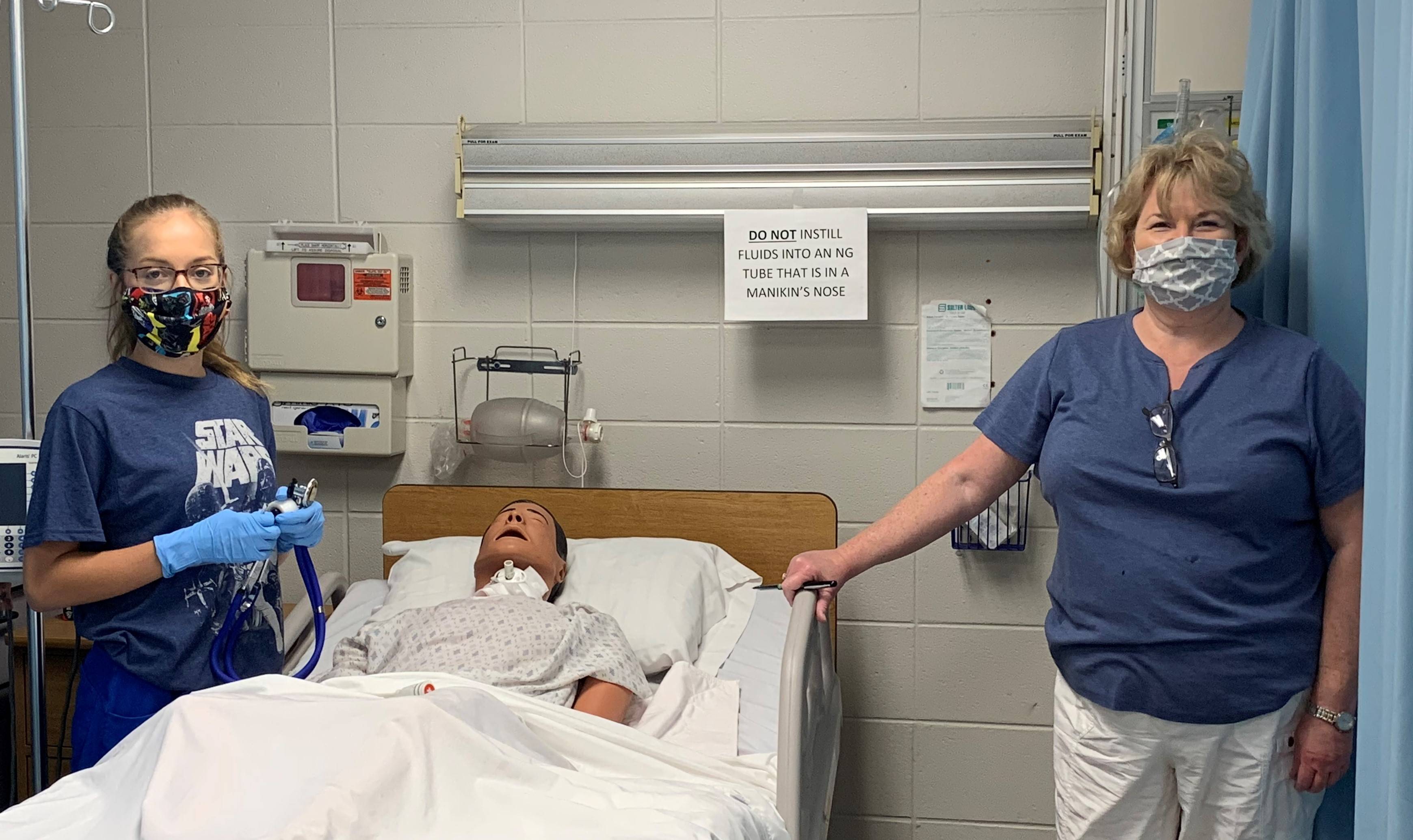 Nursing student Autumn Hall and Professor Teddi Ratliff in nursing lab; Student Elivia Jordan and Dr. Patsy Jackson in nursing lab